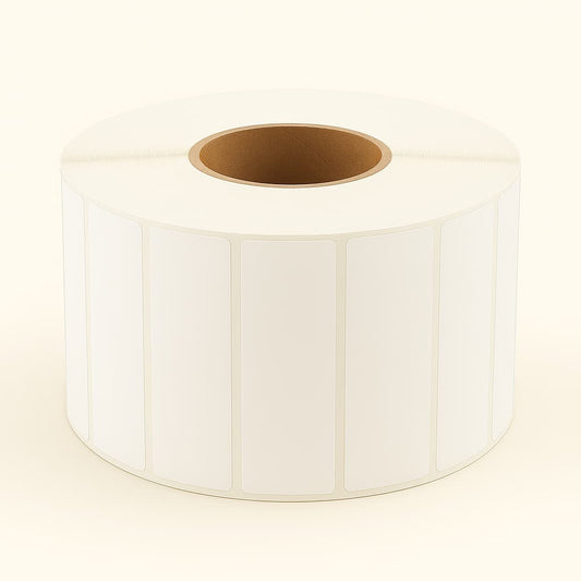 Large roll of white thermal adhesive labels with evenly spaced rectangular labels and a sturdy brown core, displayed on a neutral background. Ideal for Depot365.ca listings featuring barcode, inventory, or packaging supplies.