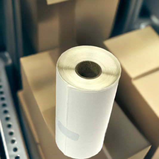 Small roll of 4x4 inch white direct thermal labels on a 0.75-inch core for compact desktop printers.